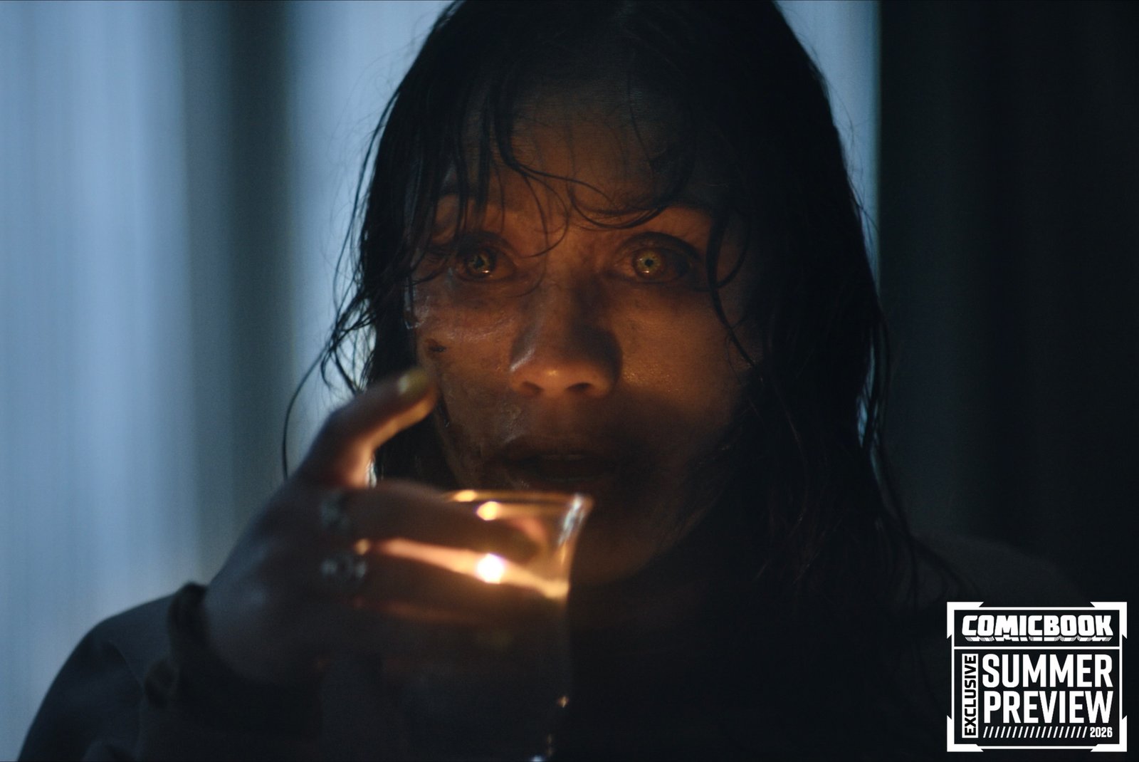 Actress Luciane Buchanan portraying a grief-stricken widow fighting for survival against deadites.